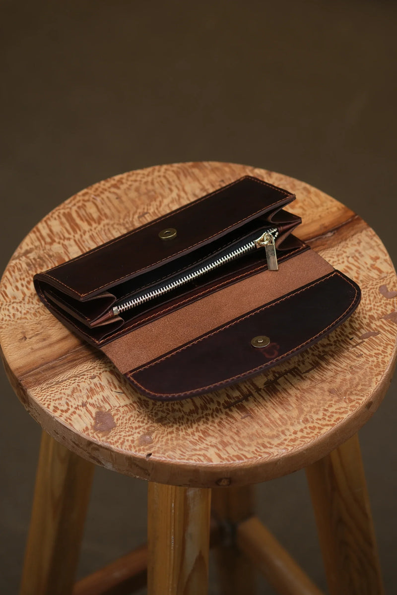 Open women's leather clutch wallet with zip pocket