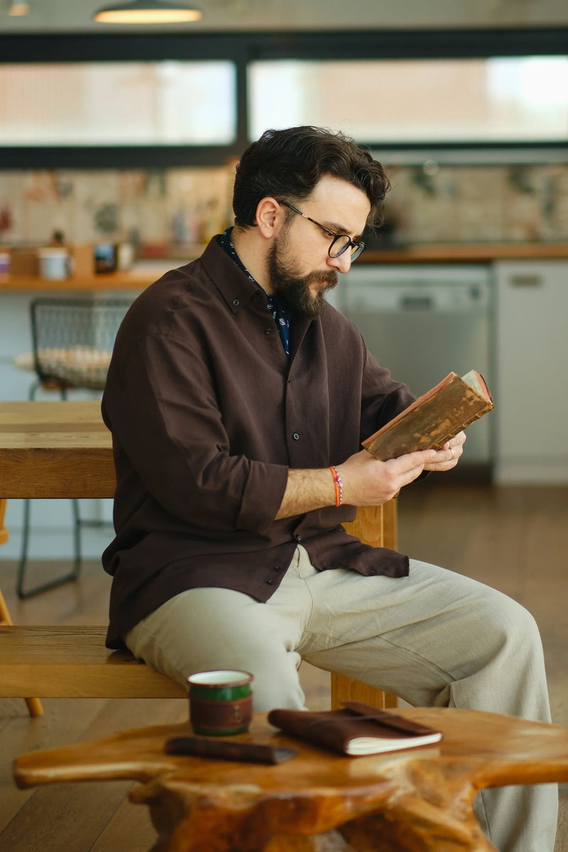 Man wearing a brown button-up shirt