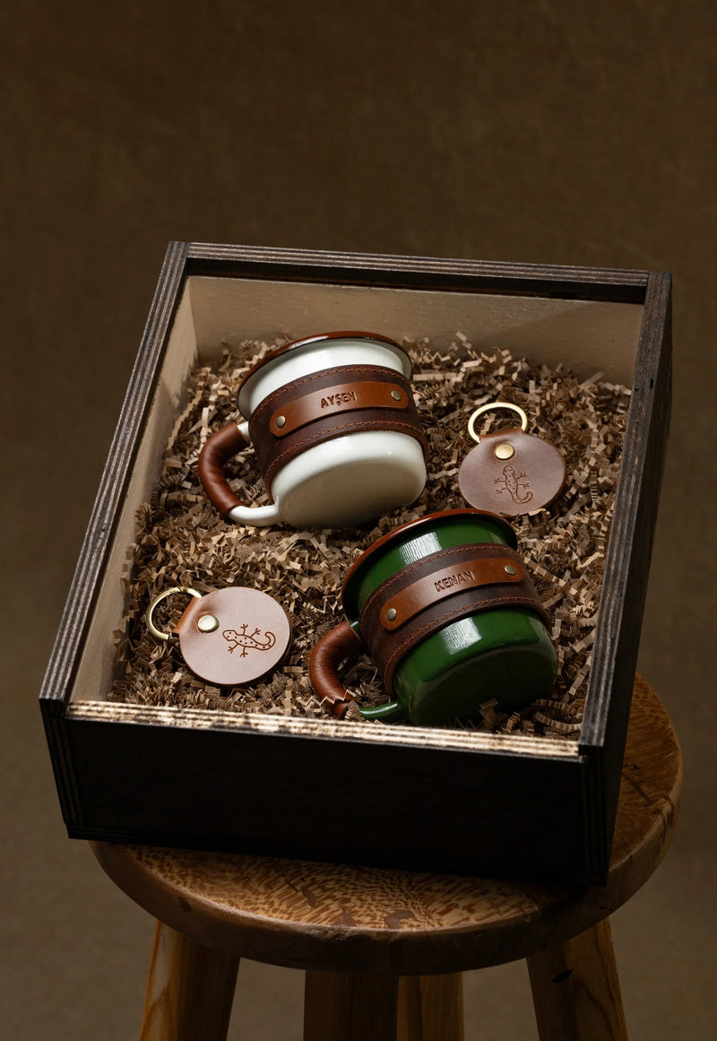 Wooden gift box with leather wrapped enamel mugs